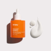 ST.SAJ Radiant Super C with white serum droplets on grey background.