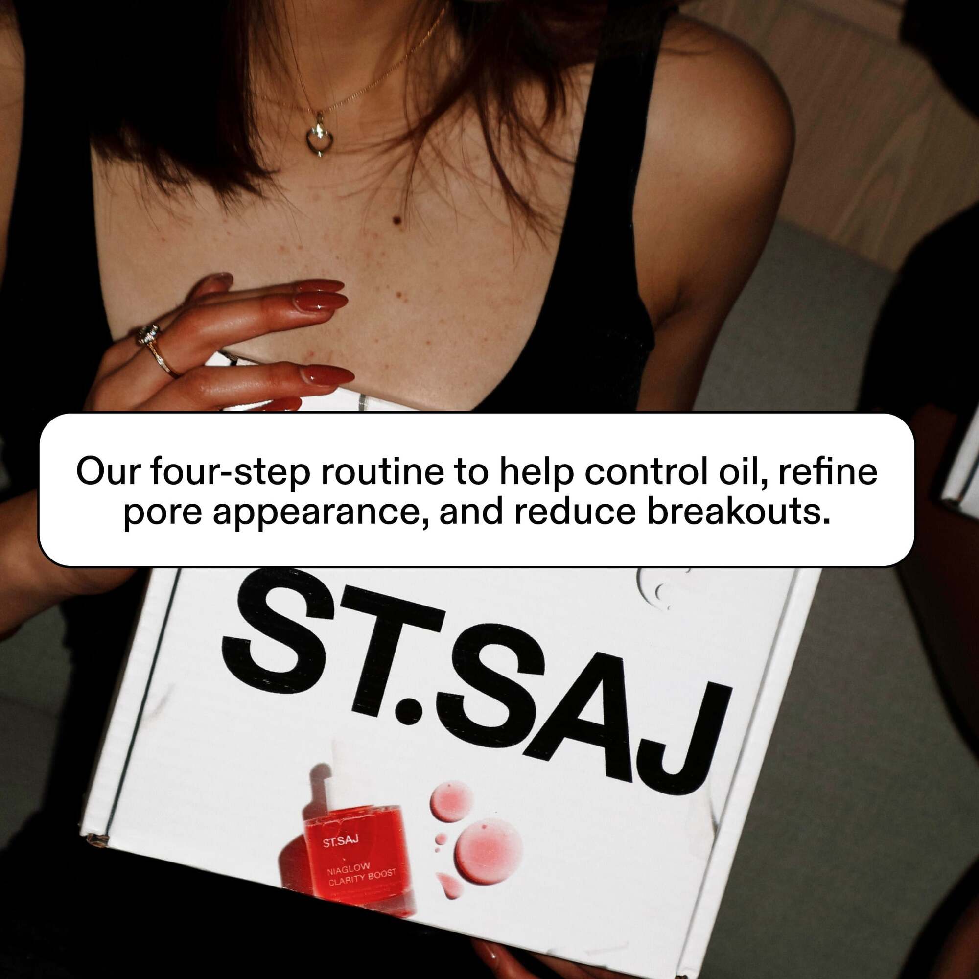 Hands holding ST.SAJ branded box, text: our four-step routine to help control oil, refine pore appearance, and reduce breakouts.