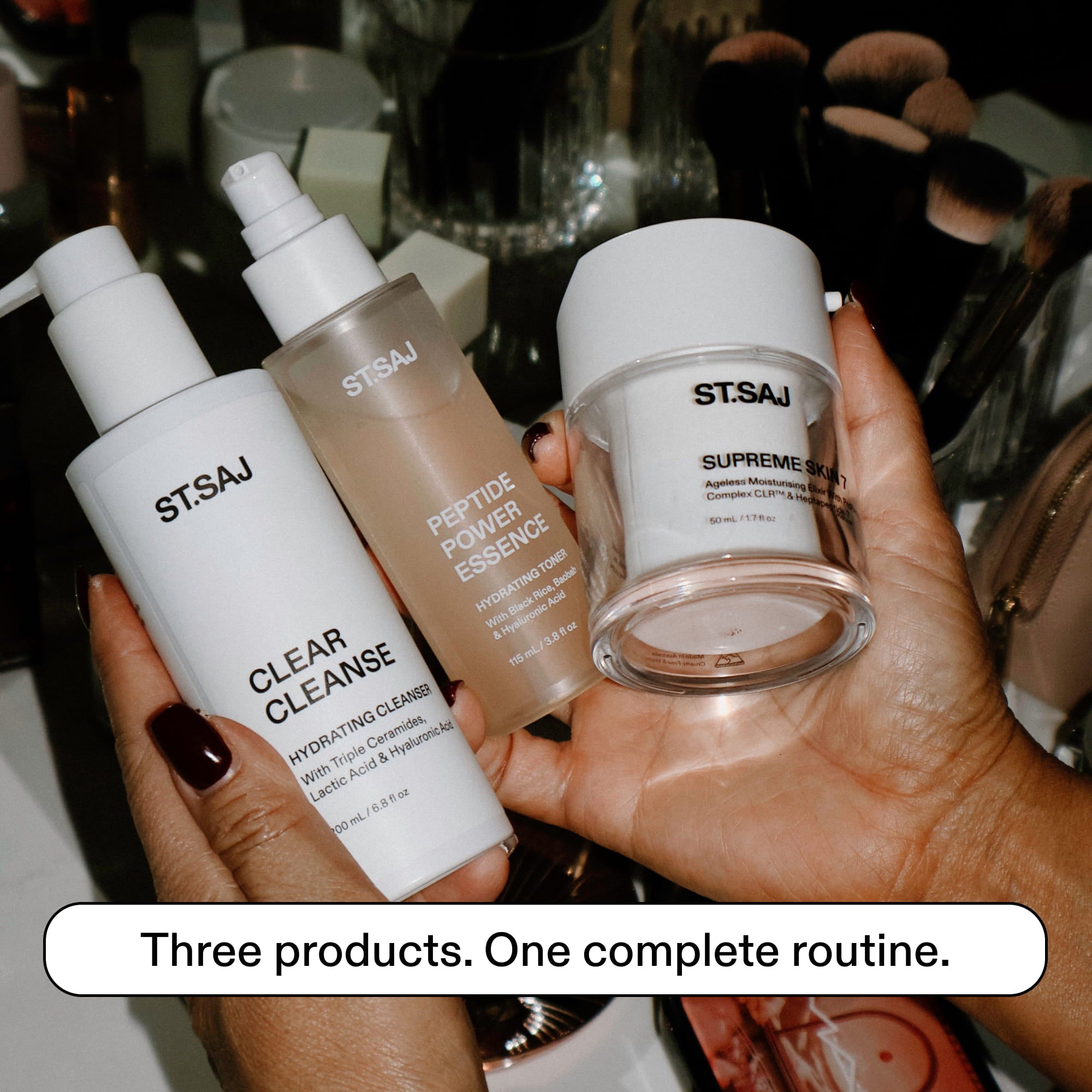 ST.SAJ Starter Routine - model holding Clear Cleanse, Peptide Power Essence and Supreme Skin 7
