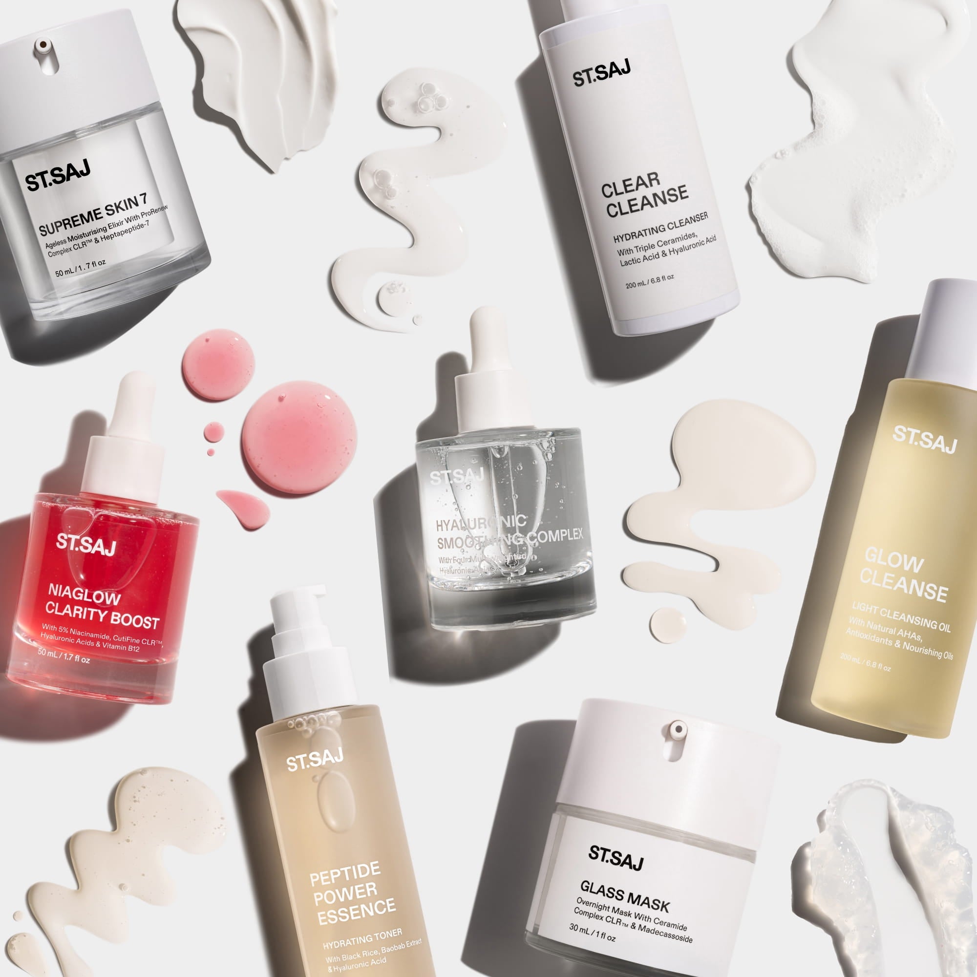 ST.SAJ Supreme Skin Kit -seven full-size products flat lay including Clear Cleanse, Glow Cleanse, Peptide Power Essence, Hyaluronic Smoothing Complext, NiaGlow Clarity Boost, Supreme Skin 7, Glass Mask