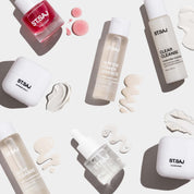 ST.SAJ On Tour Mini Kit products with cream swatches scattered on white background.