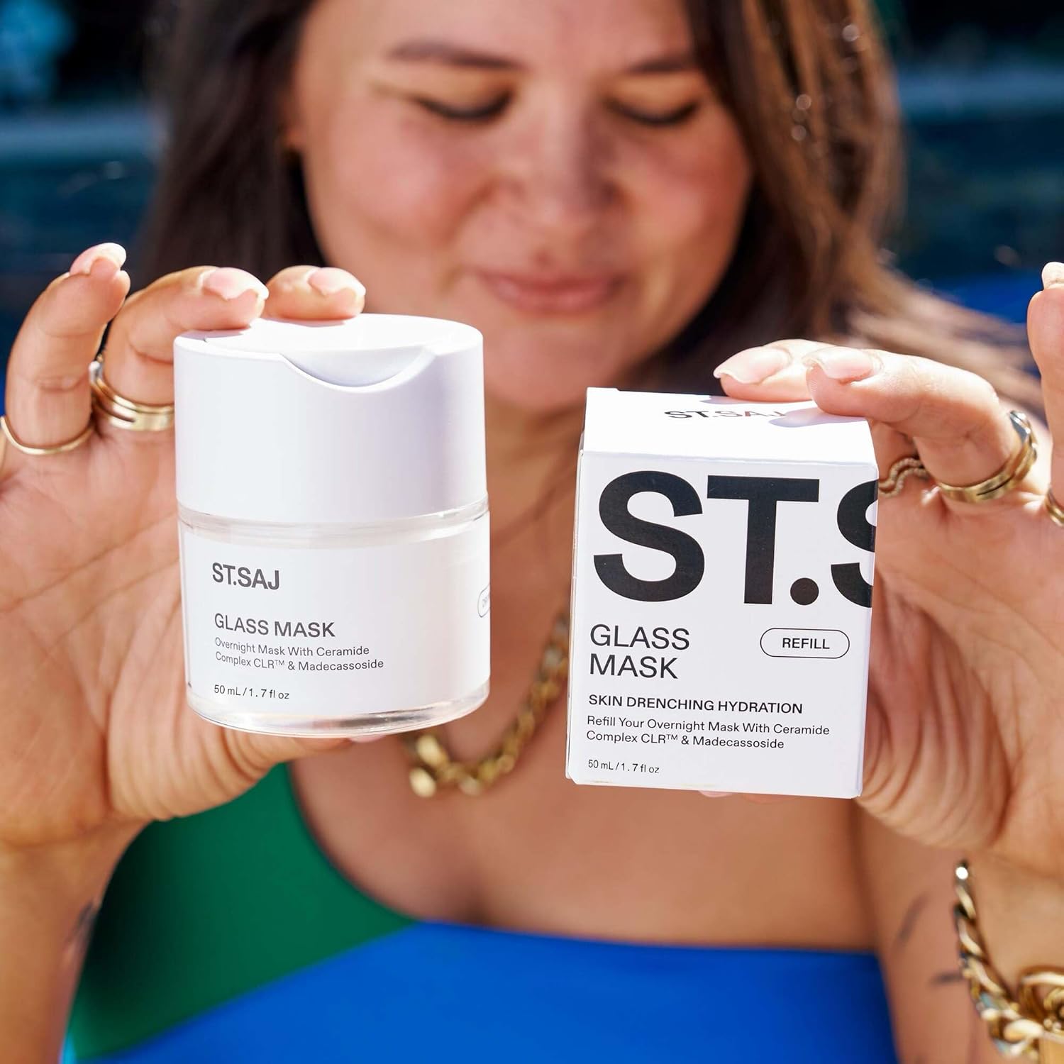 Emmylou holding ST.SAJ Glass Mask Refill jar