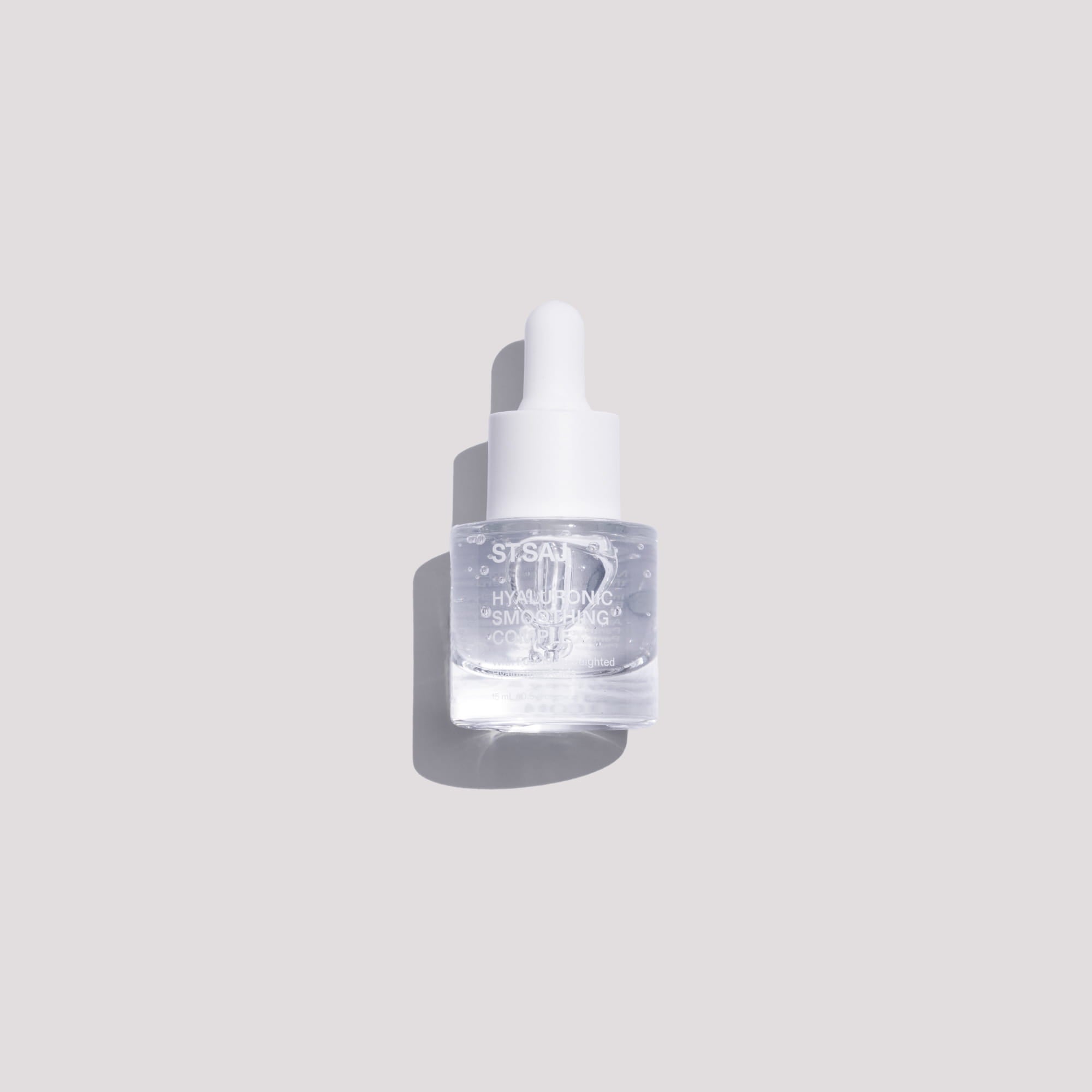 A clear glass dropper bottle of Susann Skin Hyaluhydrating Serum with a white dropper cap, set against a solid light gray background with a soft shadow.
