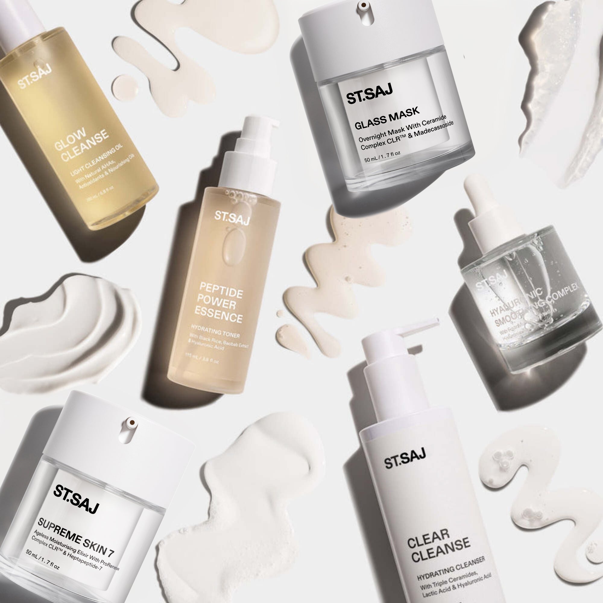 ST.SAJ Hydrate & Repair Kit - 6 full-size products with cream swatches in editorial flat lay