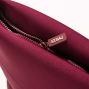 ST.SAJ Serious Skin Lover Bag - close-up of rose gold zip and ST.SAJ branded zip pull detail