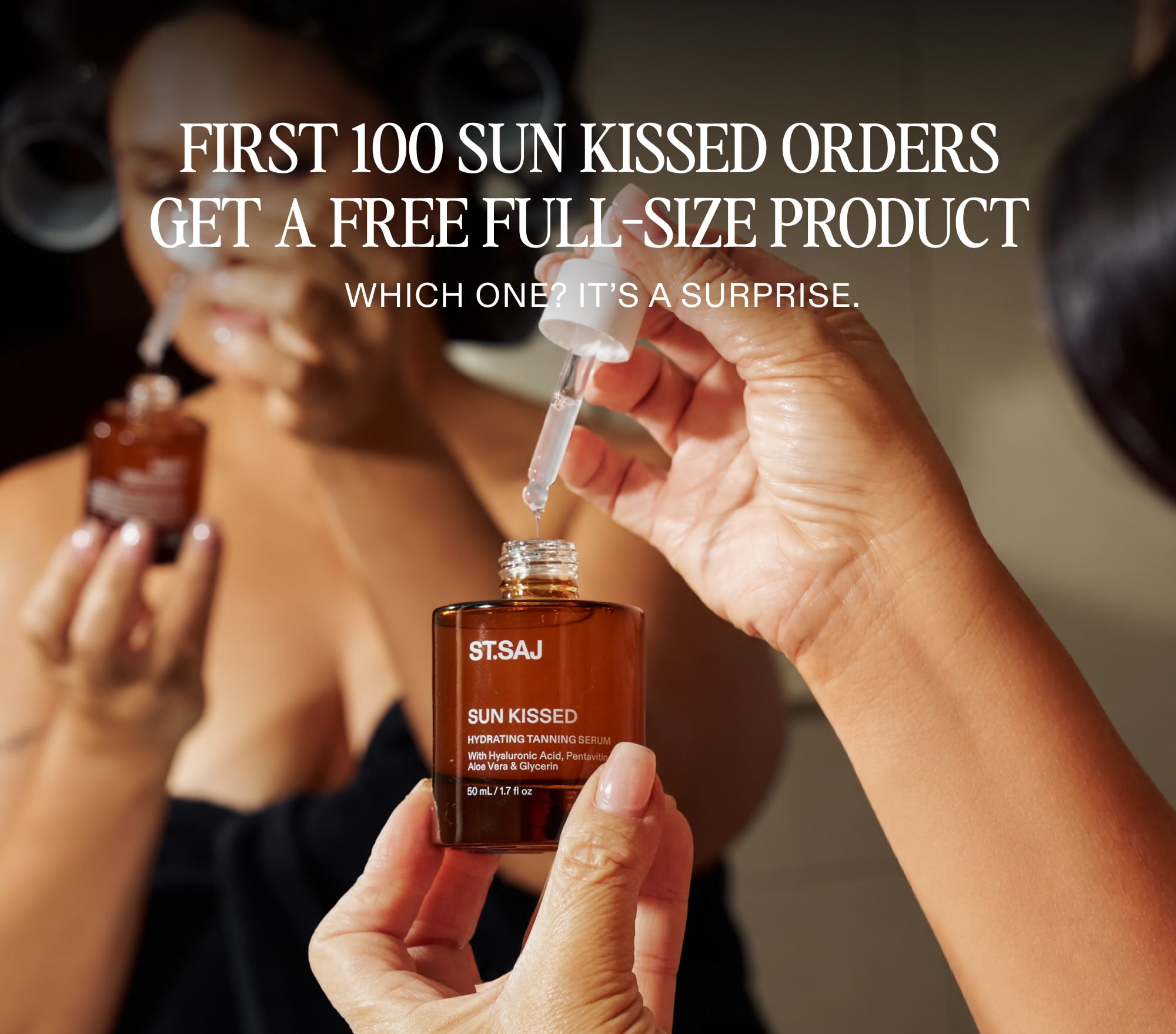 First 100 Sun Kissed orders get a free full-size ST.SAJ product. Emmylou in hair rollers applying Sun Kissed tanning serum with dropper